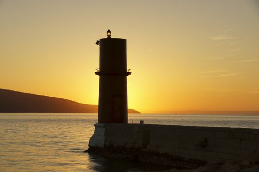 this is a photo of red lighthouse on coast