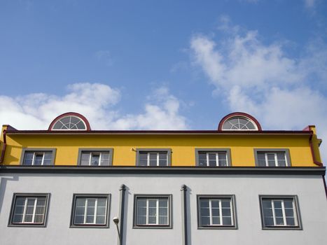 Beautiful penthouse on a roof of the colourful house in the city of Tallinn