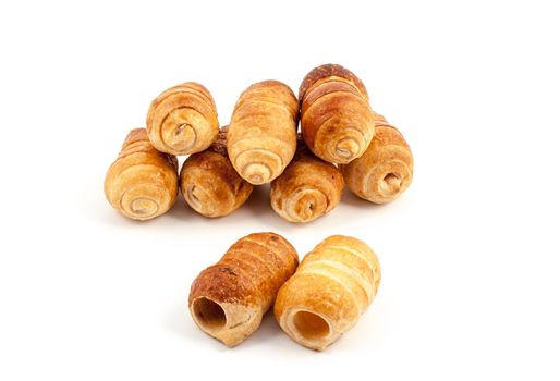 Small group of empty italian pastry, cannoli, on white background