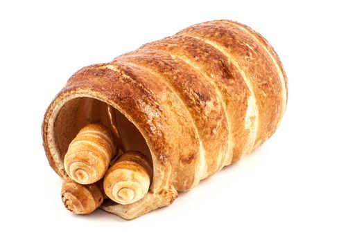 Three empty typical italian cannoli pastry and a big one on white background