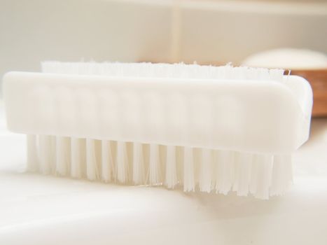 White nail brush, in bathroom, on sink, hygienic