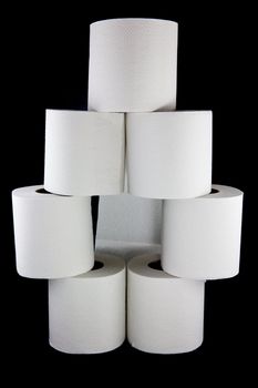 A picture of 7 toilet paper rolls stacked