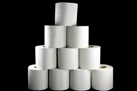 Picture of a bunch of toilet paper rolls formed as a pyramid