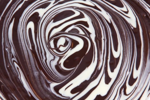 Picture of white and black chocolate mixed together forming a texture
