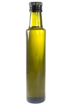 Picture of one bottle of olive oil with light comming trough