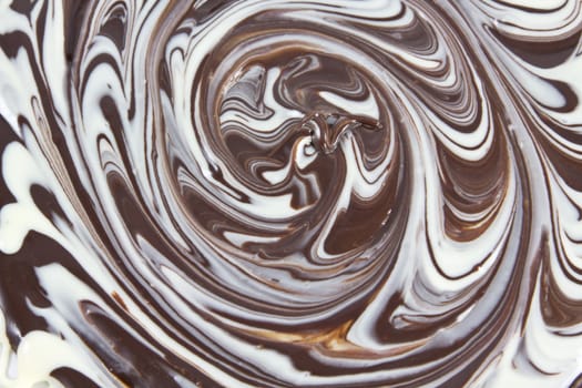 Picture of white and black chocolate mixed together forming a texture