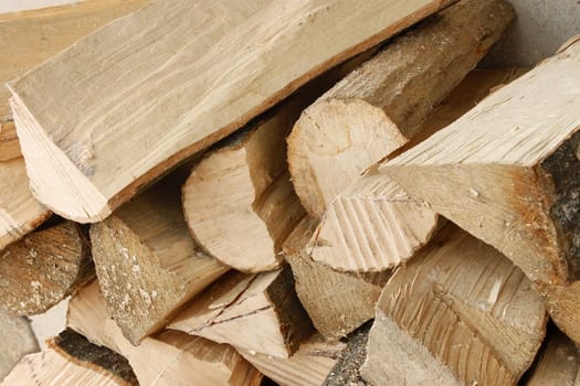 Heap of dried stacked hornbeam firewood close up