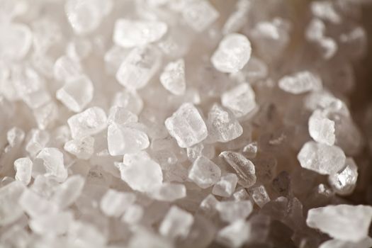 Crystals of of table salt in close-up, side lighting