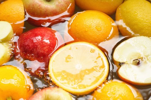 fresh fruit, apples, lemons, oranges, - swim in juice, water..