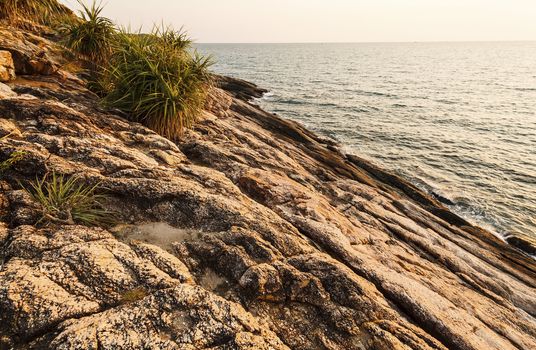 Before beatiful sunrise on the rocks, Rayong, Thailand.