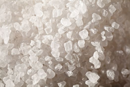 Crystals of of table salt in close-up, side lighting
