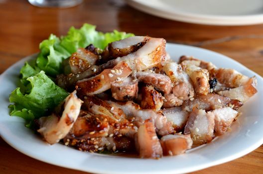 a delicious sliced grilled pork  served with vegetables