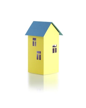 Nice yellow paper house with green roof on white background with reflection. Clipping path is included
