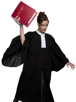 Women dress as a canadian attorney, throwing a red book of criminal law with bilingual text on it