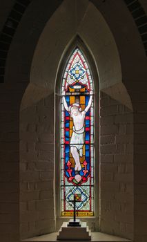 Stained Glass Window depicting Christ on the cross wearing the crown of thorns