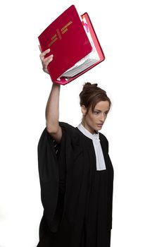 Women dress as a canadian attorney, holding very high up, a red book of criminal law with bilingual text on it