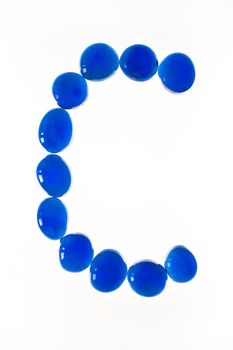 Close up of a glass nugget letter