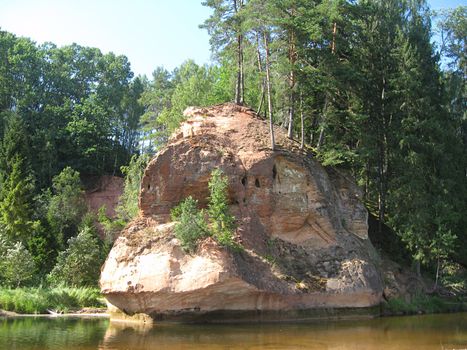 Zvārta Rock is one of the most spectacular outcrops of Devon rock formations in Latvia, set in the territory of the Gauja National Park. The Zvārta Rock has been formed by the River Amata gnawing at the sandstone on its banks.