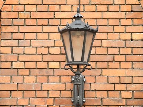 Lantern on the wall of bricks