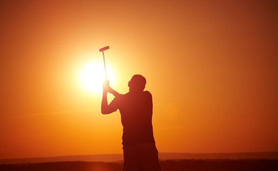 man play golf on sunset,selective focus on head