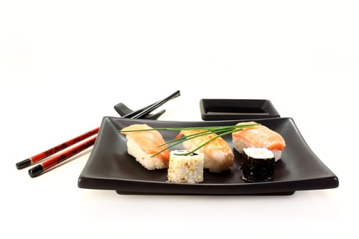 variety of sushi with parsley and chives