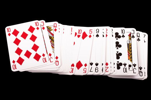 close up of playing cards poker game on black background 