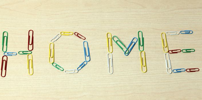 Home words made with colorful paper clips
