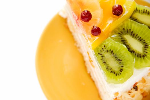 Birthday cake with cream with fruit on the white background