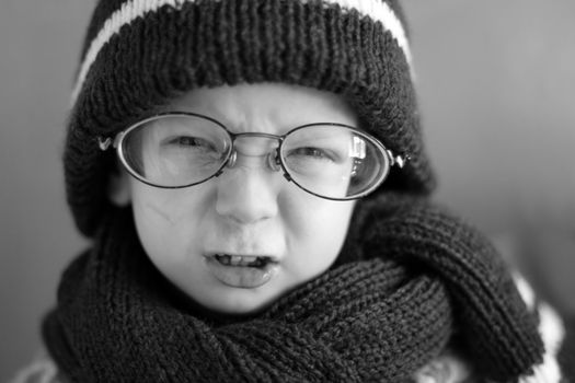 boy in a cap and glasses