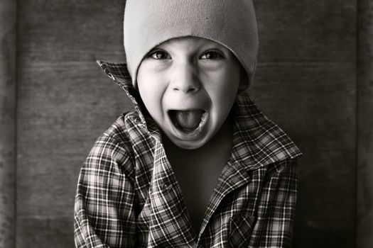 boy in the hat shouted, black and white photography