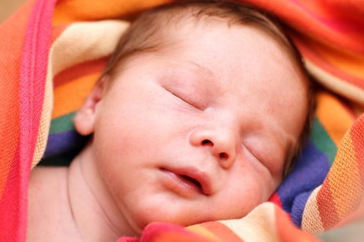 portrait of a close-up, infant lying on the bed