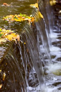 A waterfall fountain in a city park