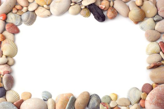 Frame made of sea pebbles and shells on white background