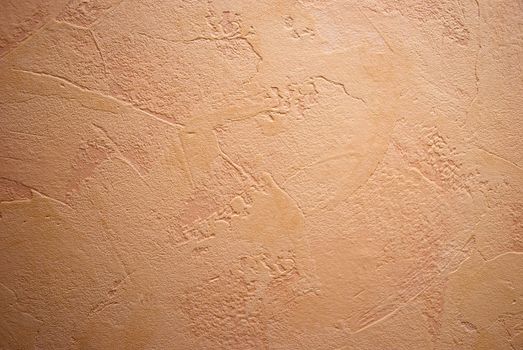 Shot of clay-colored embossed wallpaper on the wall