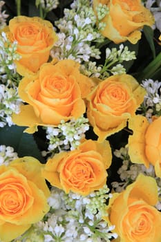 a yellow rose bouquet with white syringas