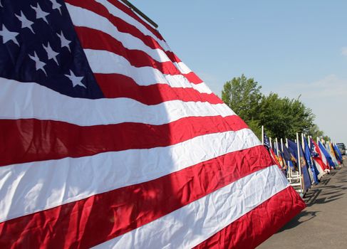 An American flag flies while in a parade