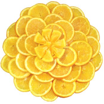 Oranges cut on segments and laid out by a flower as a still-life