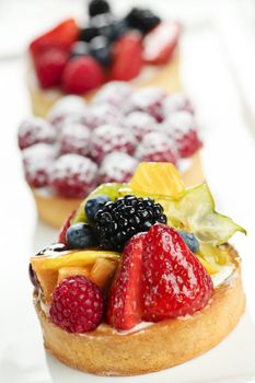 Closeup of fancy gourmet fresh fruit dessert tarts