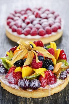Fresh dessert tarts with assorted fruits and berries