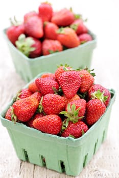 Two containers of fresh organic red strawberries