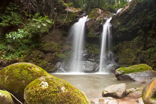 Waterfall in forest . Waterfall is a place that will make you relax and fresh . in Nan Province of Thailand