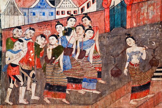 Ancient Buddhist temple mural depicting a Thai daily life scene at Wat Phumin, a famous temple in Nan province, Thailand. The temple is open to the public and has beautiful murals on the walls.