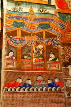 Ancient Buddhist temple mural depicting a Thai daily life scene at Wat Phumin, a famous temple in Nan province, Thailand. The temple is open to the public and has beautiful murals on the walls.