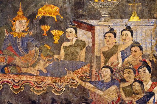 Ancient Buddhist temple mural depicting a Thai daily life scene at Wat Phumin, a famous temple in Nan province, Thailand. The temple is open to the public and has beautiful murals on the walls.