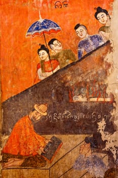 Ancient Buddhist temple mural depicting a Thai daily life scene at Wat Phumin, a famous temple in Nan province, Thailand. The temple is open to the public and has beautiful murals on the walls.