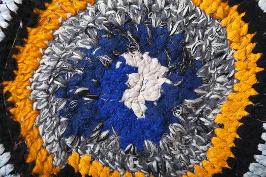 Handmade rug crocheted of colorful fabric ribbons