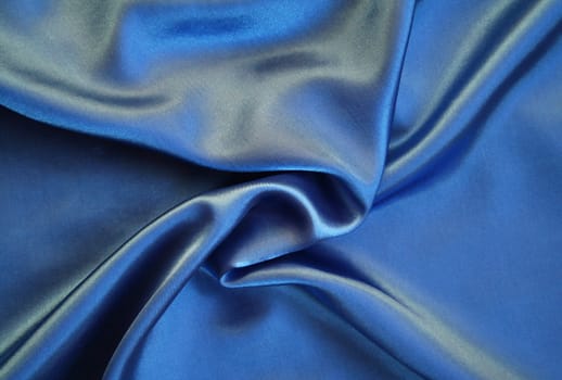 Smooth elegant blue silk as background 