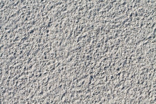 Close up of dry sand ideal for backgrounds and compositions.