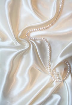 Smooth elegant white silk with pearls can use as wedding background 
