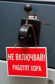 Industrial circuit breaker with a sign